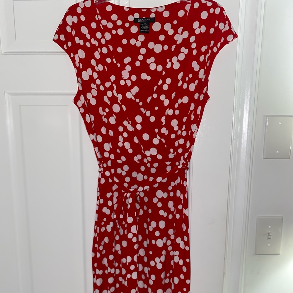 Red and white polka dot wrap dress with crossed chest area.